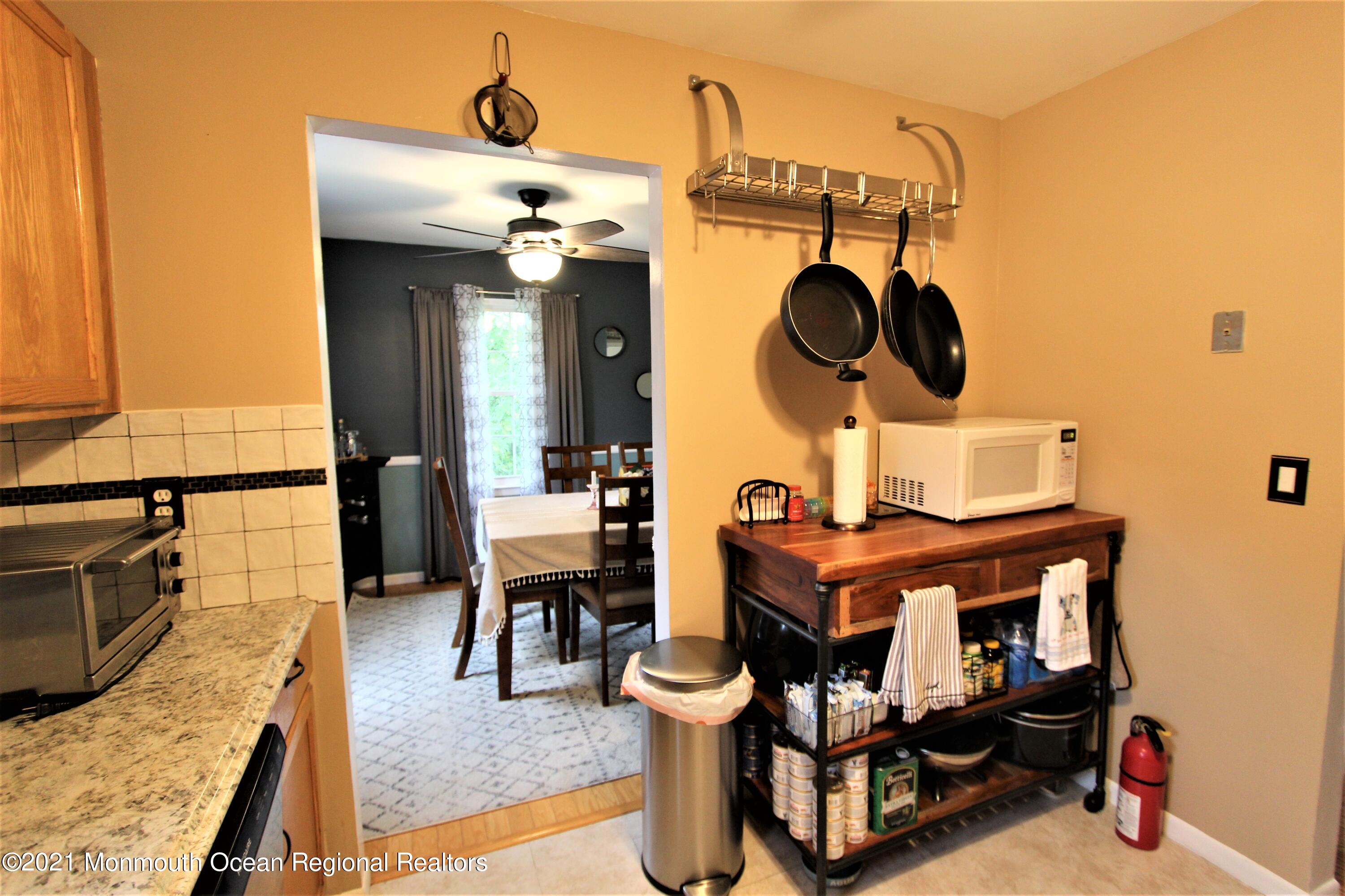 231 Atlantic Street, Unit 48 Keyport, NJ 07735 - Photo 14 of 32 a living room with furniture and a fireplace