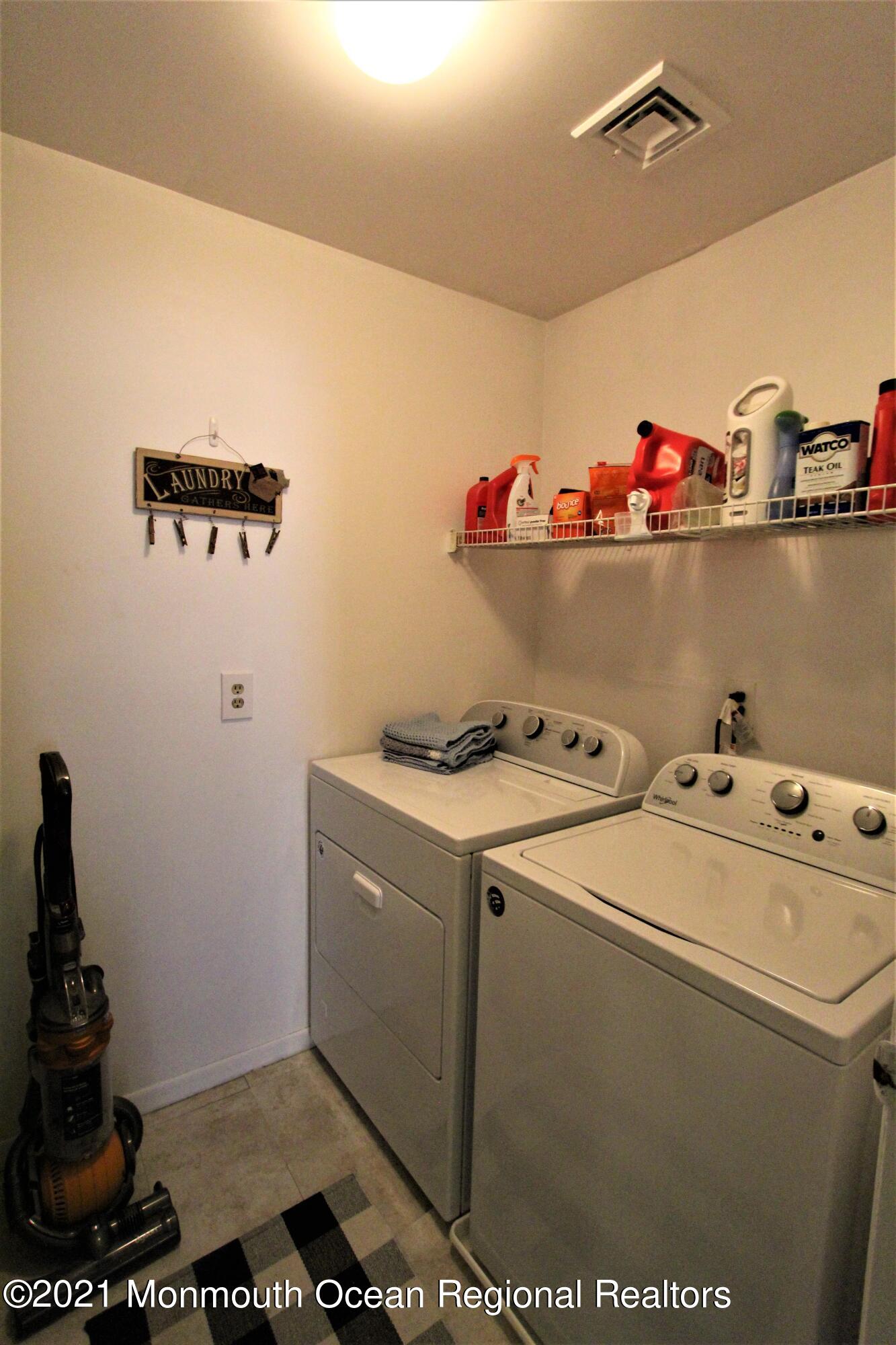 231 Atlantic Street, Unit 48 Keyport, NJ 07735 - Photo 18 of 32 a utility room with dryer and washer