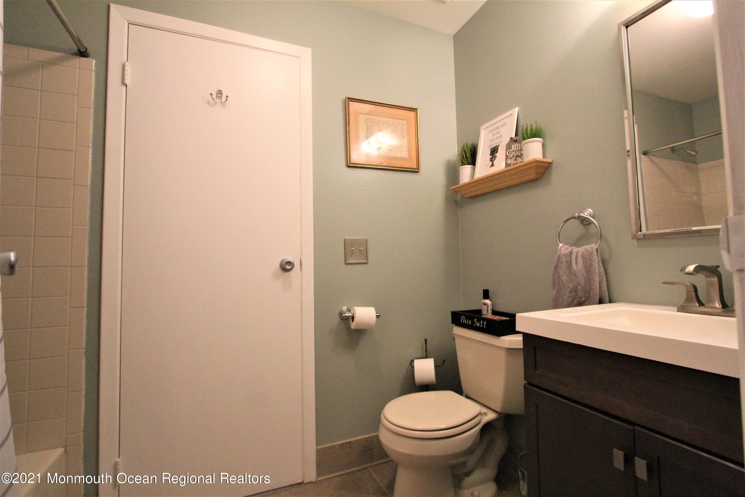 231 Atlantic Street, Unit 48 Keyport, NJ 07735 - Photo 30 of 32 a bathroom with a sink and a toilet