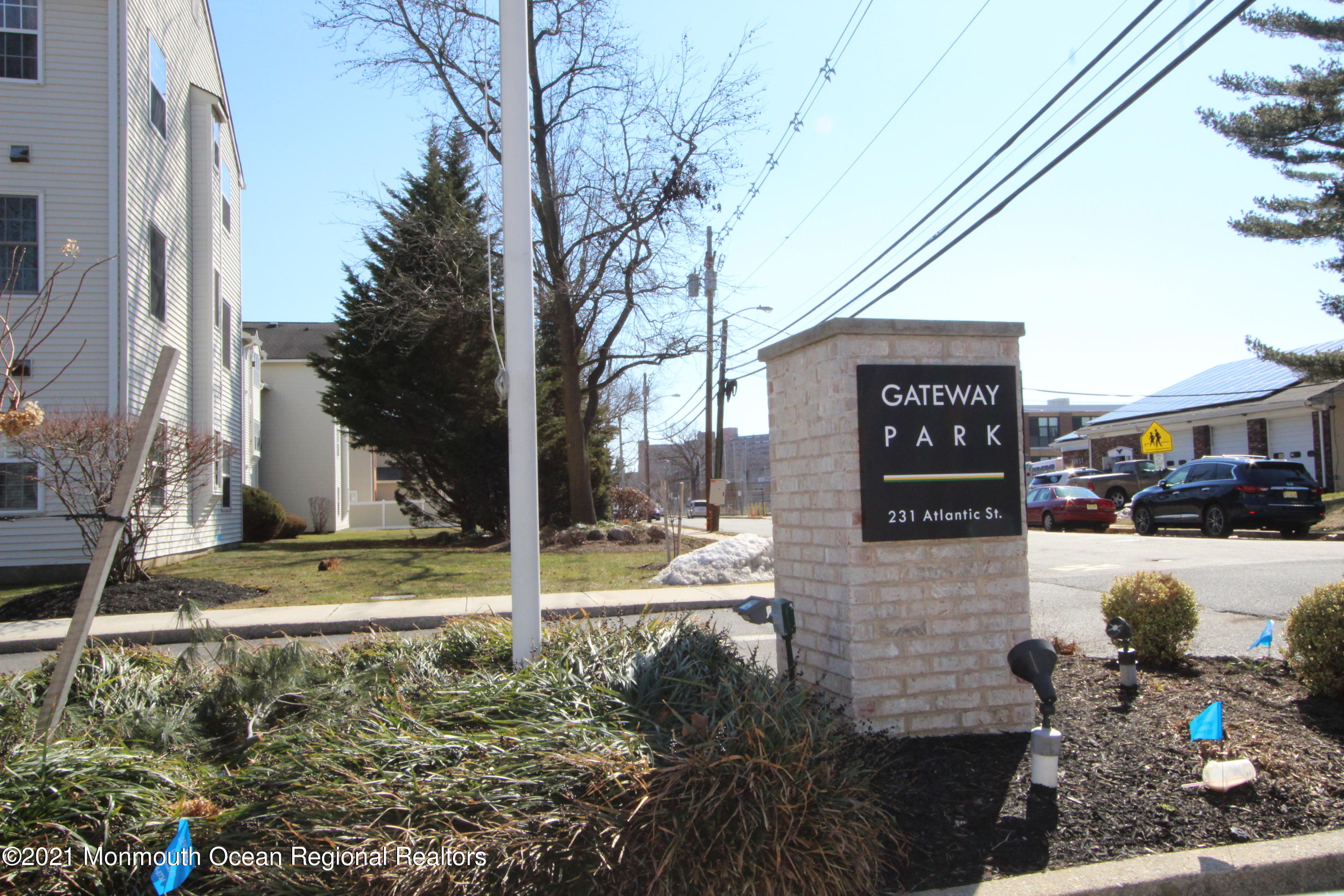 231 Atlantic Street, Unit 48 Keyport, NJ 07735 - Photo 32 of 32 a street sign on a sidewalk next to a road
