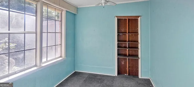 an empty room with windows