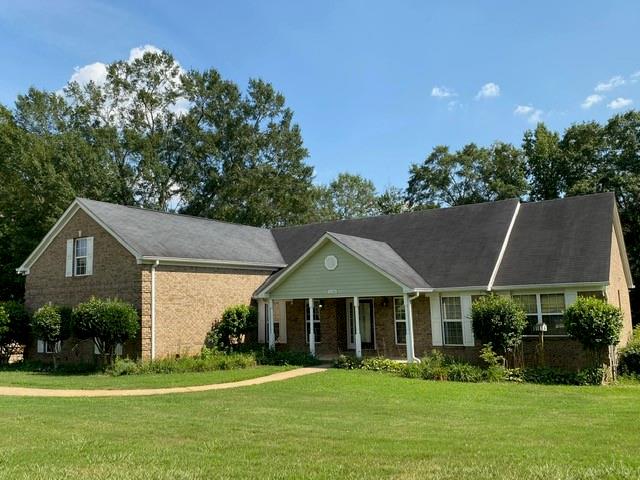 1135 Oak Hill Road Covington, GA 30016 - Photo 1 of 1 a view of a house with a yard