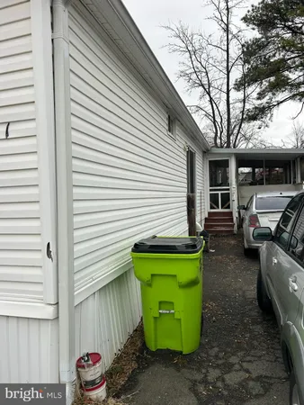 a view of a backyard with sitting area and furniture