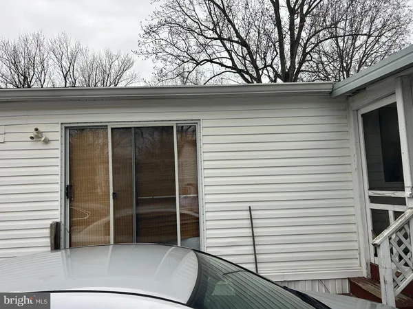 a view of backyard with cabin