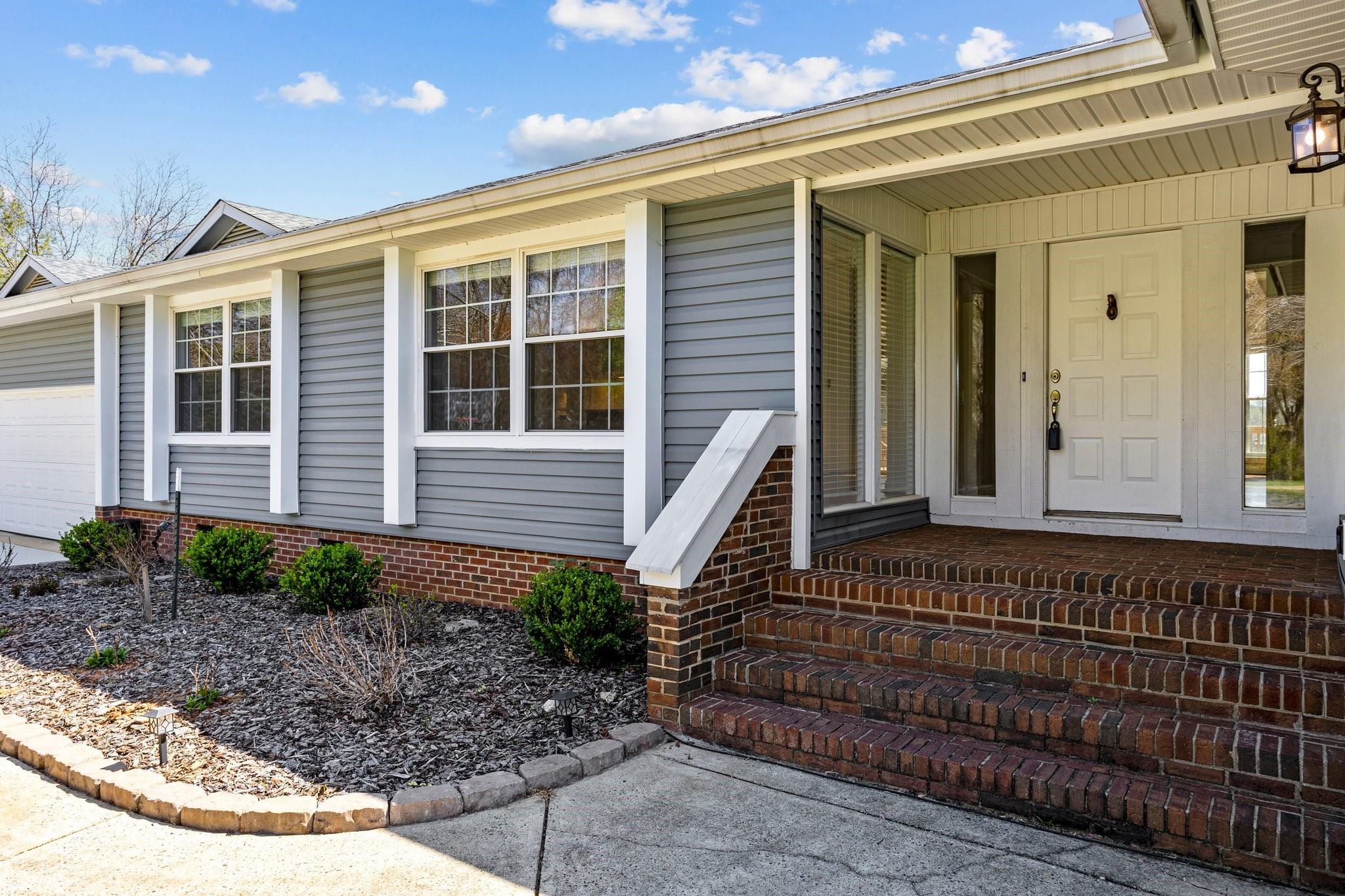 a front view of a house with a porch
