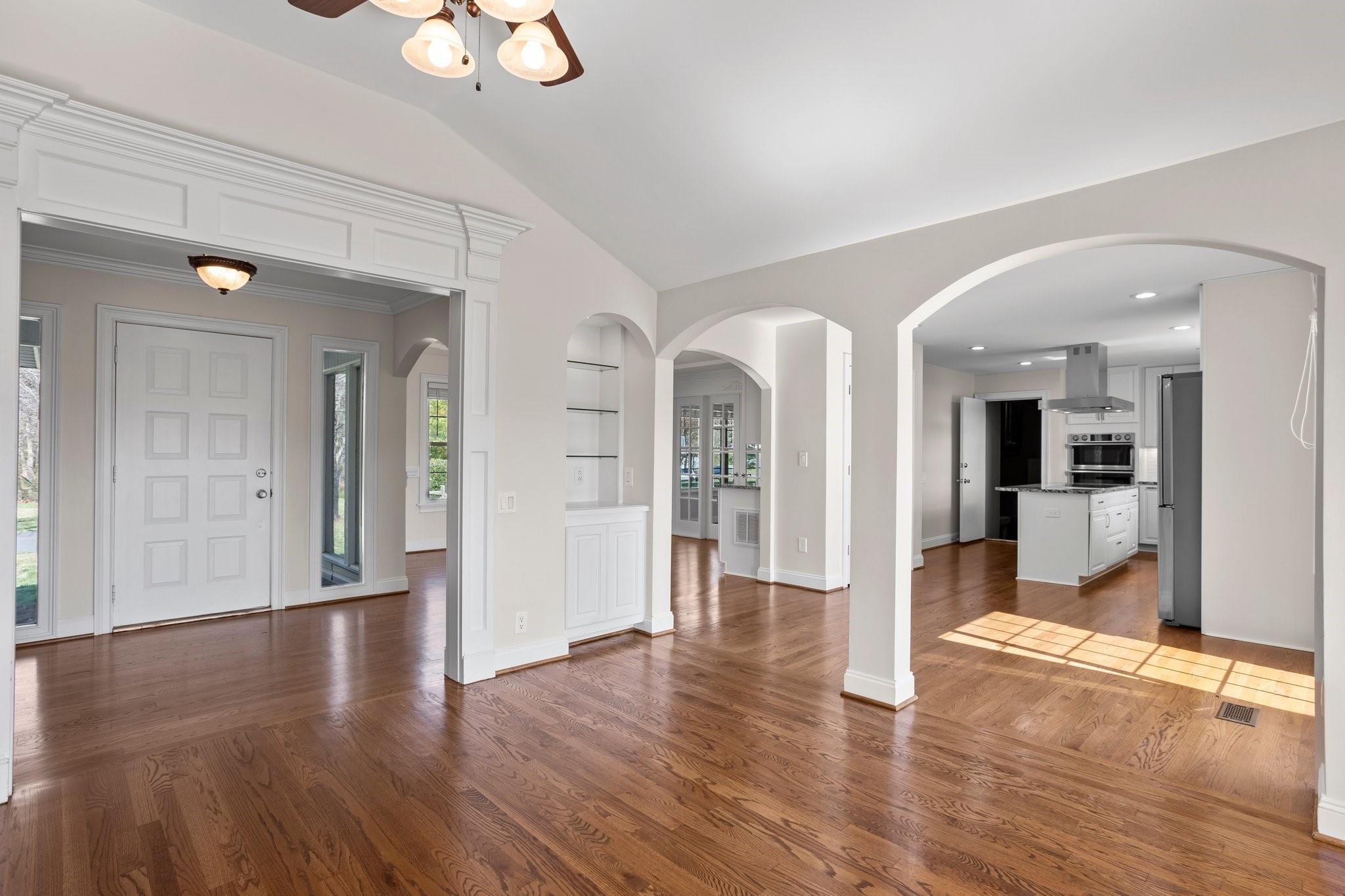 15020 Ranson Road, Unit A Huntersville, NC 28078 - Photo 13 of 25 a view of a hallway with wooden floor and chandelier