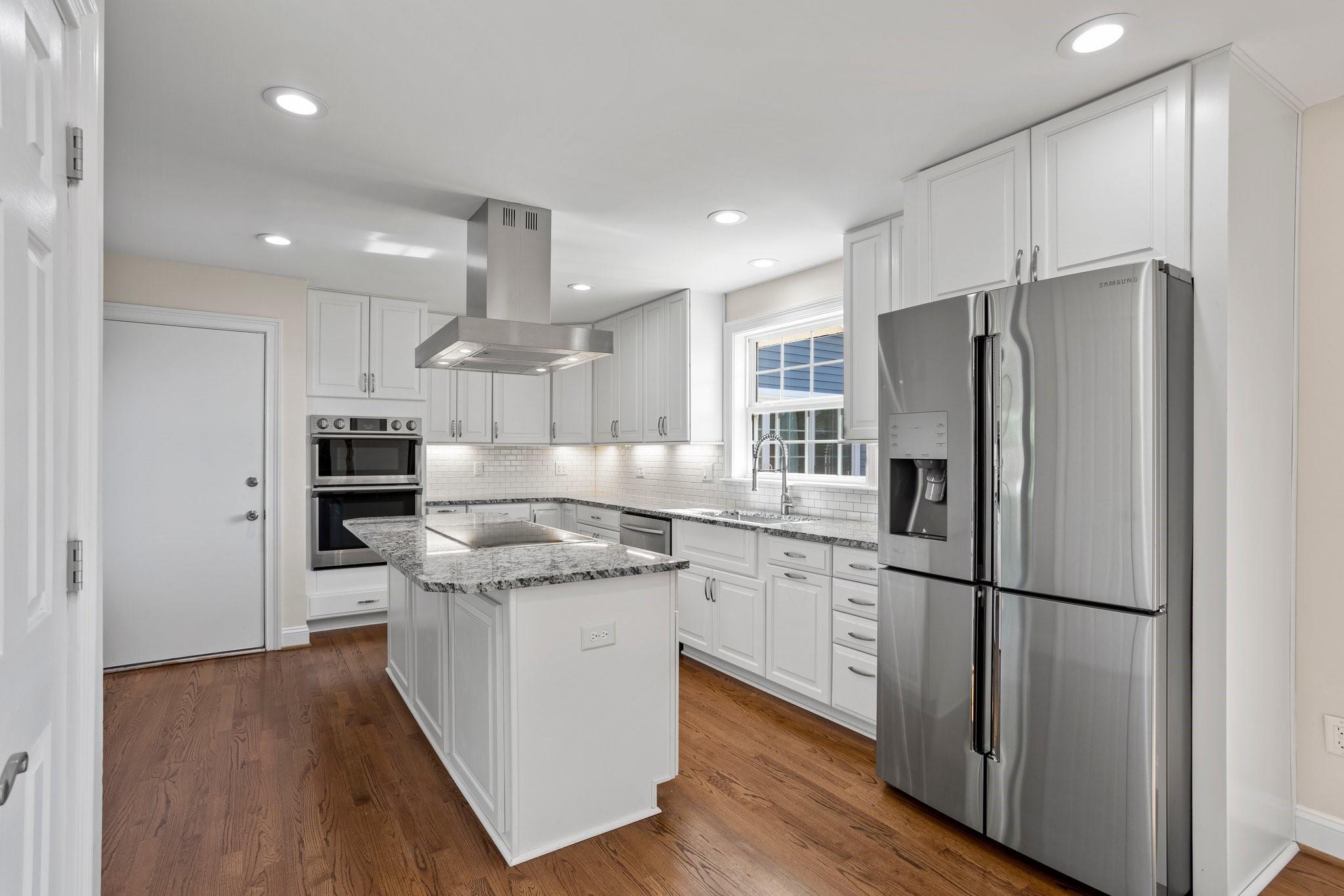 15020 Ranson Road, Unit A Huntersville, NC 28078 - Photo 15 of 25 a kitchen with stainless steel appliances granite countertop a refrigerator a stove and a sink
