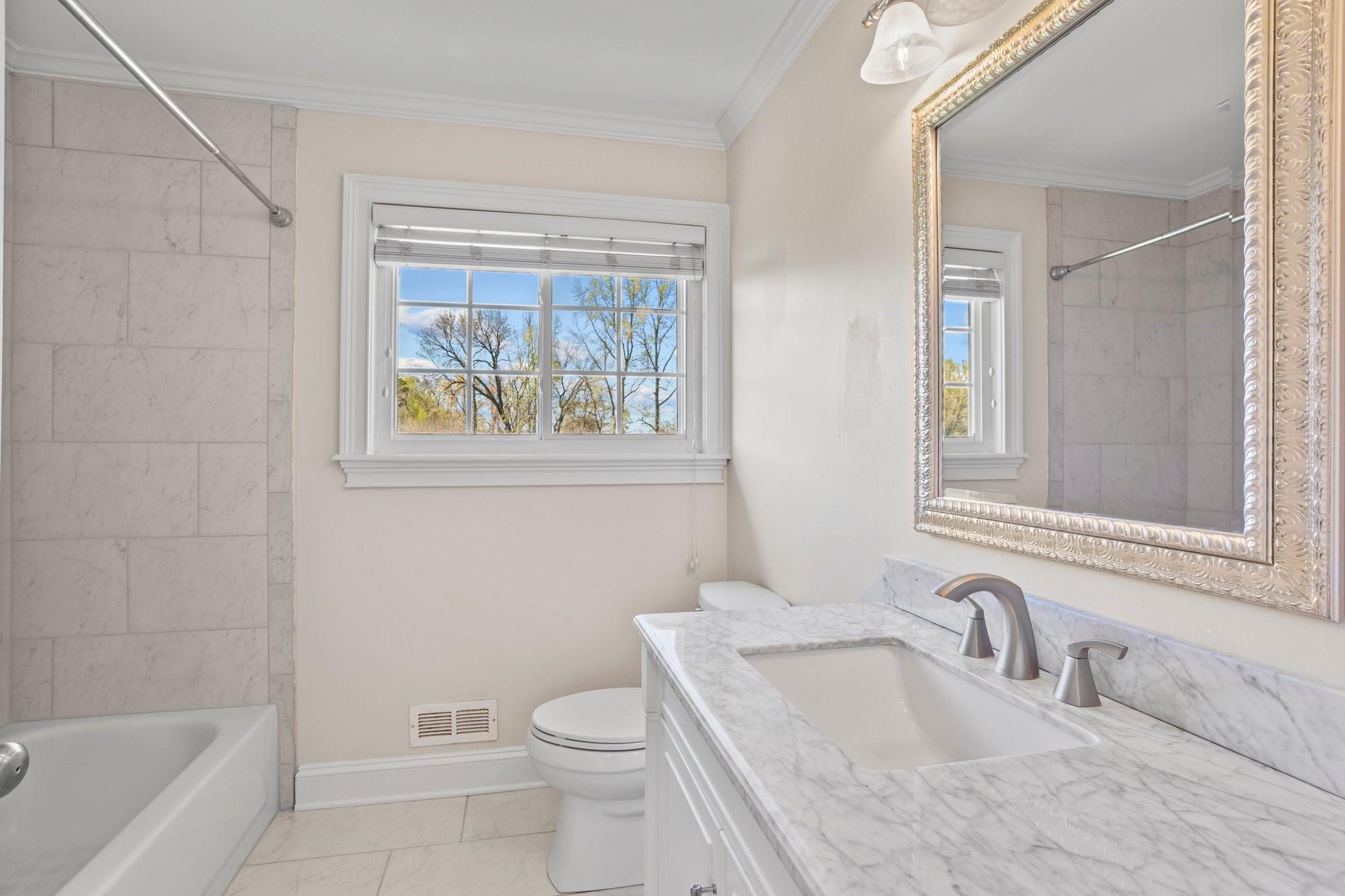 15020 Ranson Road, Unit A Huntersville, NC 28078 - Photo 25 of 25 a bathroom with a sink toilet and window