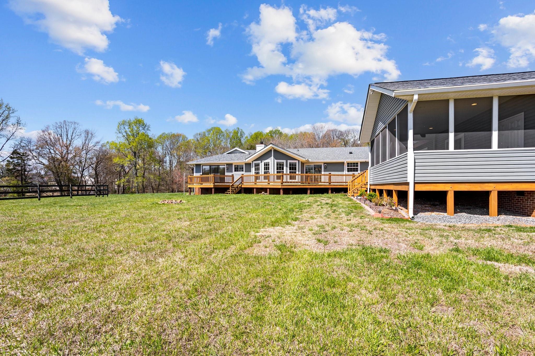 15020 Ranson Road, Unit A Huntersville, NC 28078 - Photo 4 of 25 a view of a house with a big yard