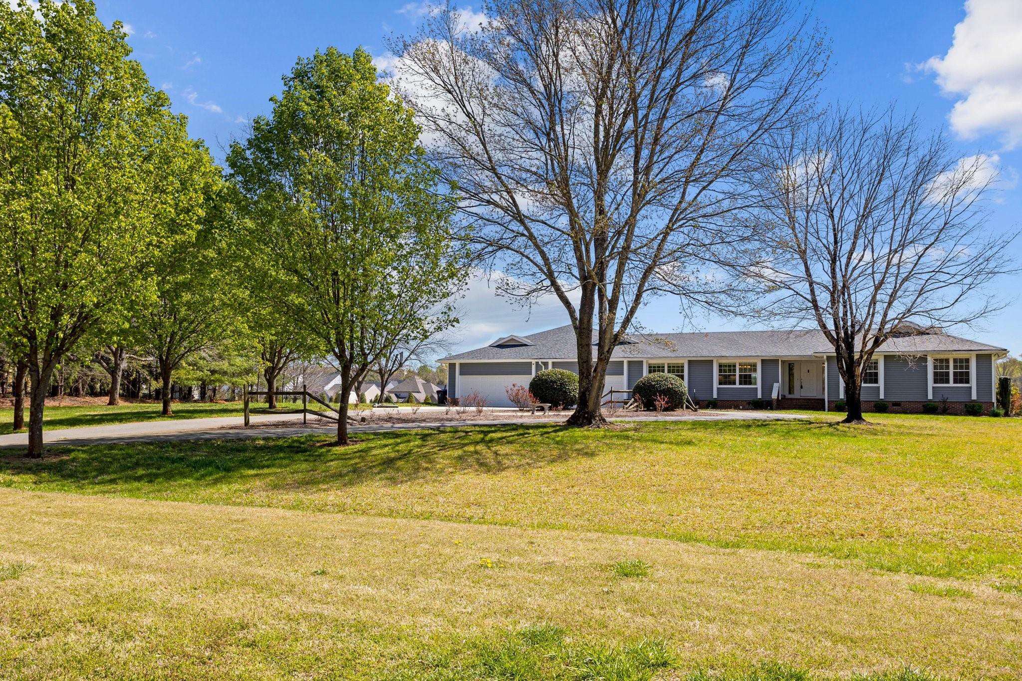 15020 Ranson Road, Unit A Huntersville, NC 28078 - Photo 6 of 25 a view of a house with a large trees