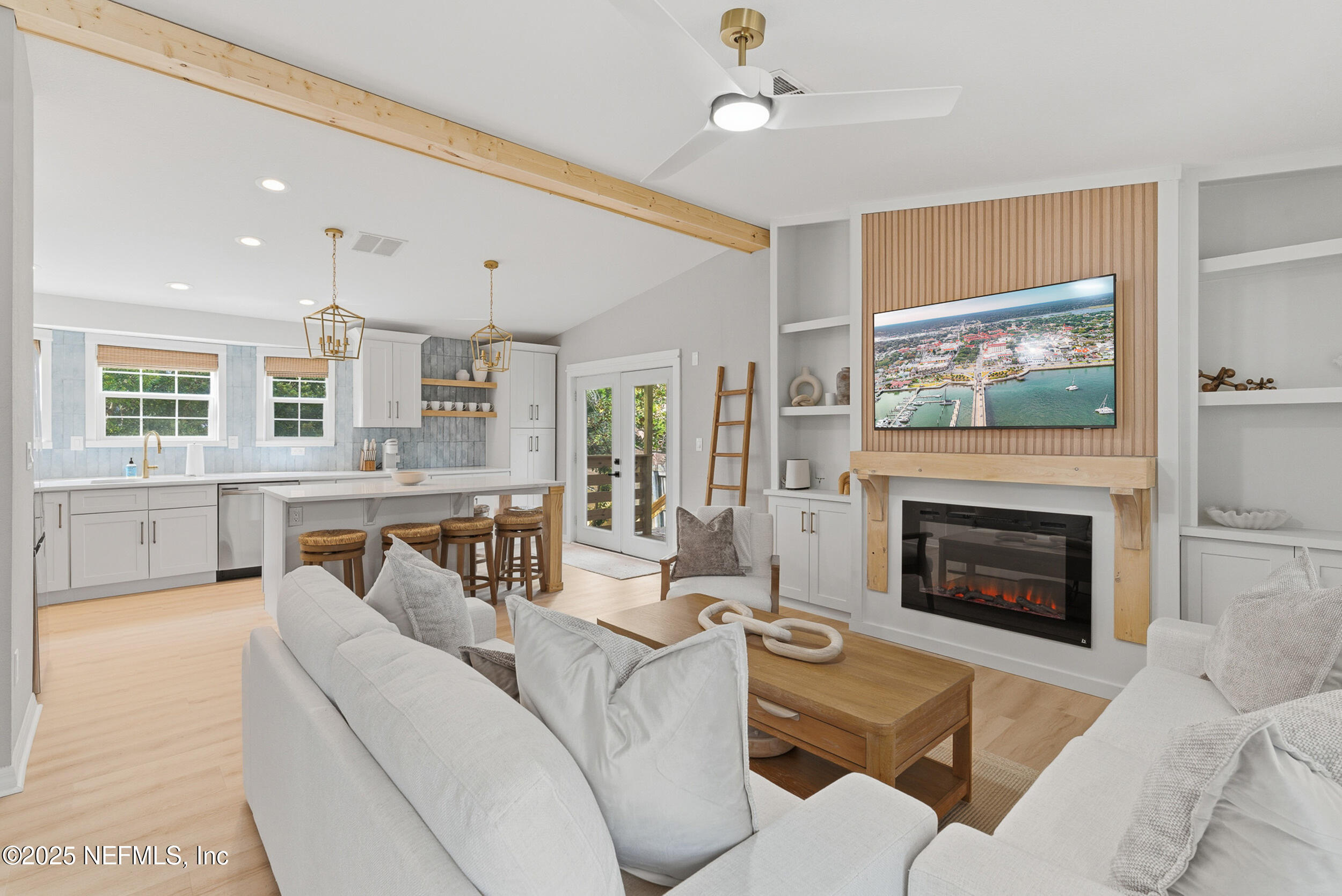 2 A Moultrie Place St. Augustine, FL 32080 - Photo 15 of 69 a living room with furniture a fireplace and a flat screen tv