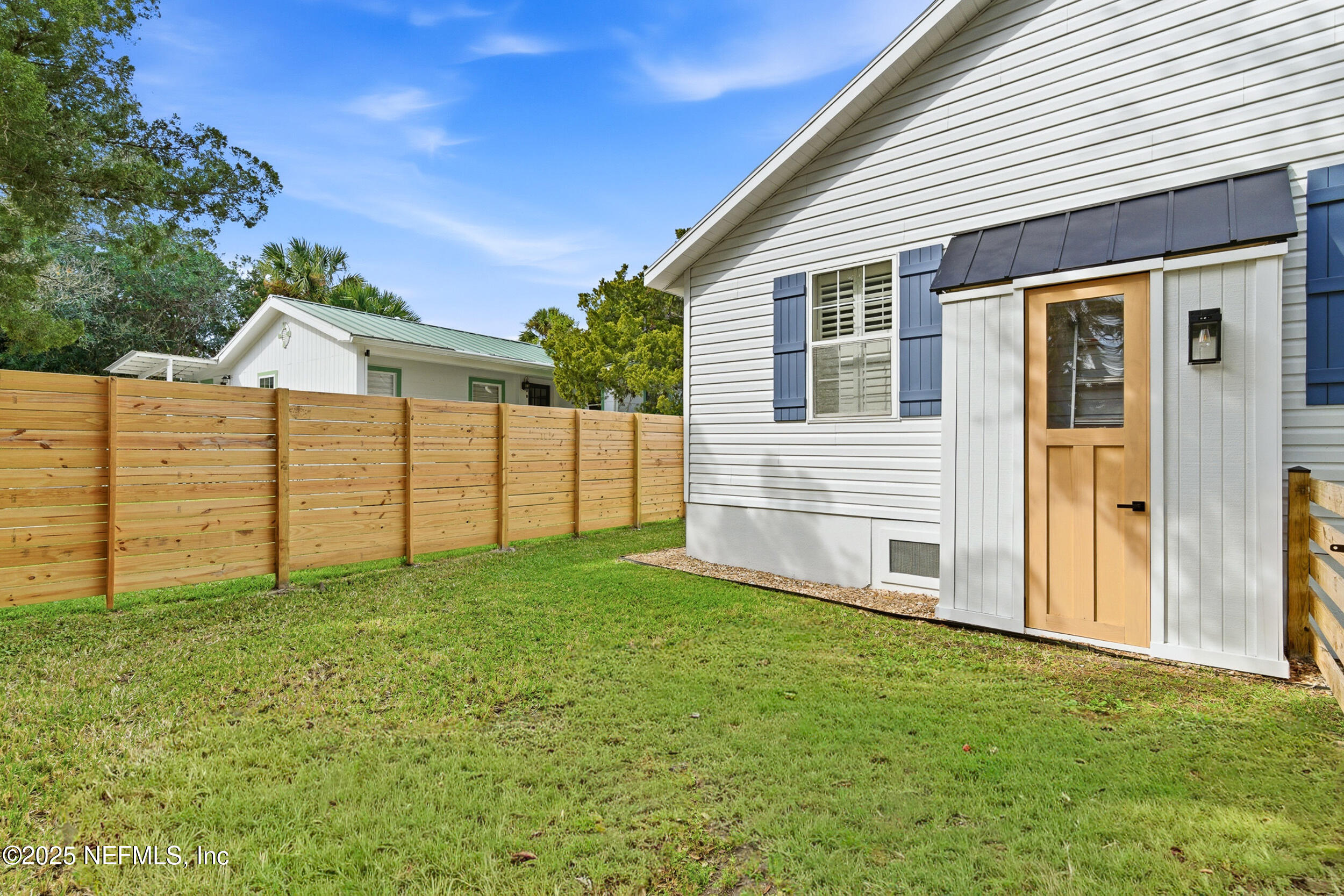 2 A Moultrie Place St. Augustine, FL 32080 - Photo 48 of 69 a view of a backyard with white house