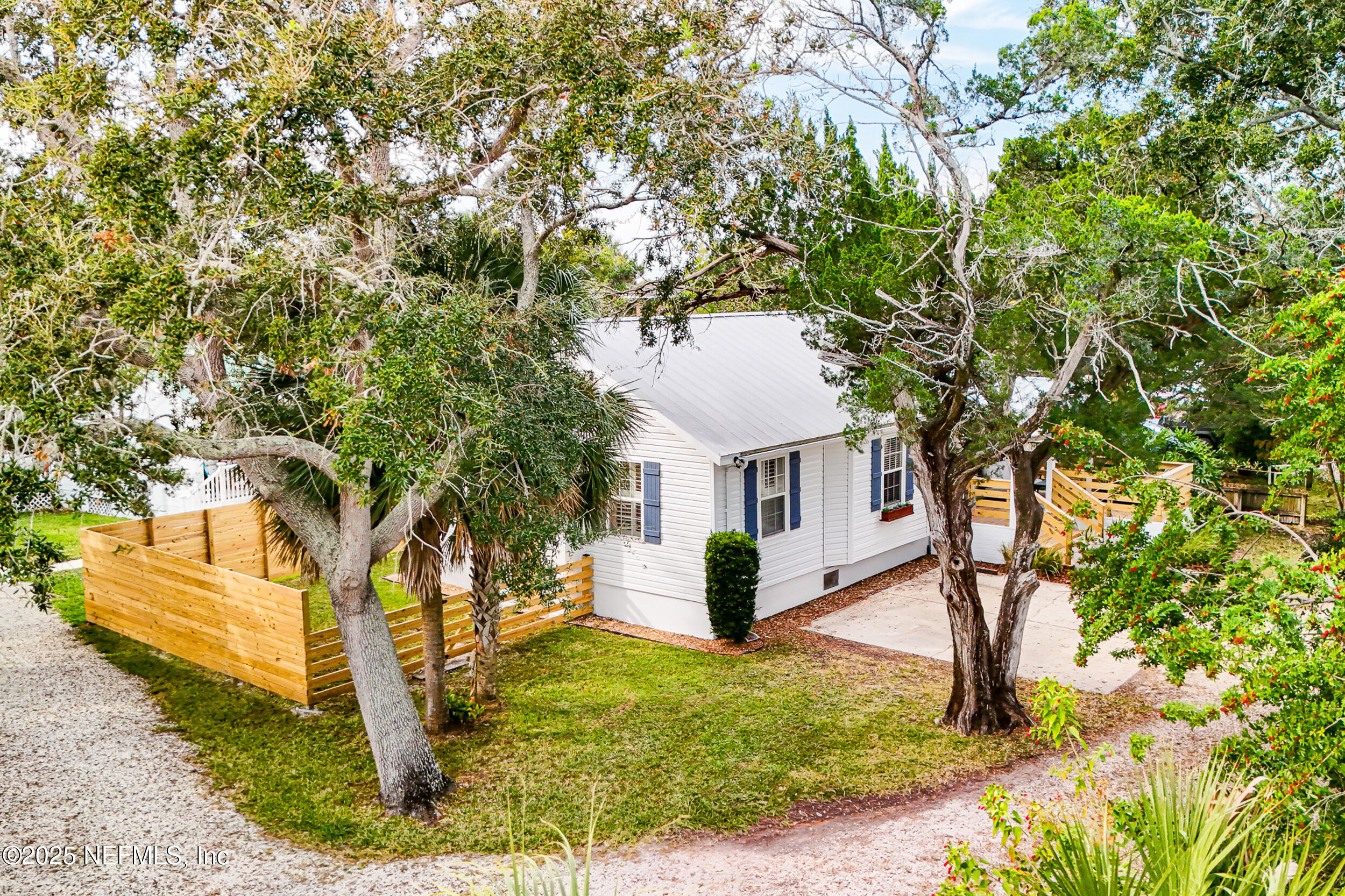 2 A Moultrie Place St. Augustine, FL 32080 - Photo 51 of 69 a front view of a house with a yard