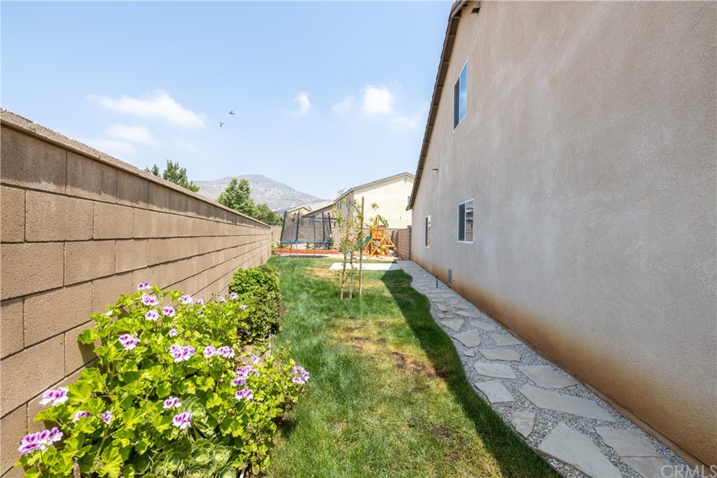6838 Reflection Way Jurupa Valley, CA 92509 - Photo 29 of 31 RIGHT SIDE YARD
