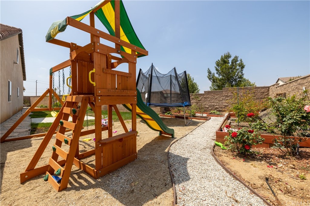 6838 Reflection Way Jurupa Valley, CA 92509 - Photo 31 of 31 RIGHT SIDE YARD PLAYGROUND