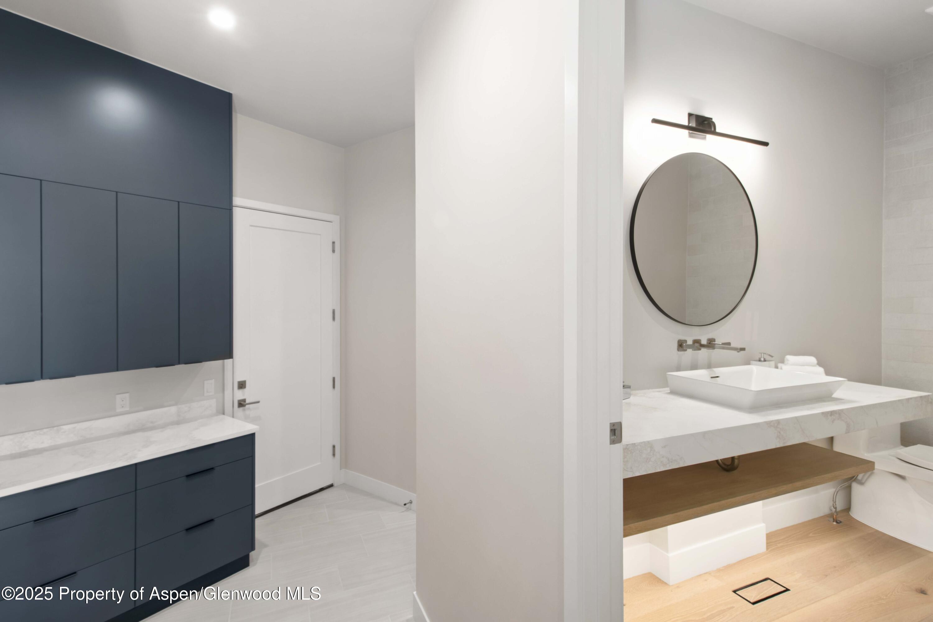719 Perry Ridge Carbondale, CO 81623 - Photo 28 of 68 a bathroom with a sink and a mirror