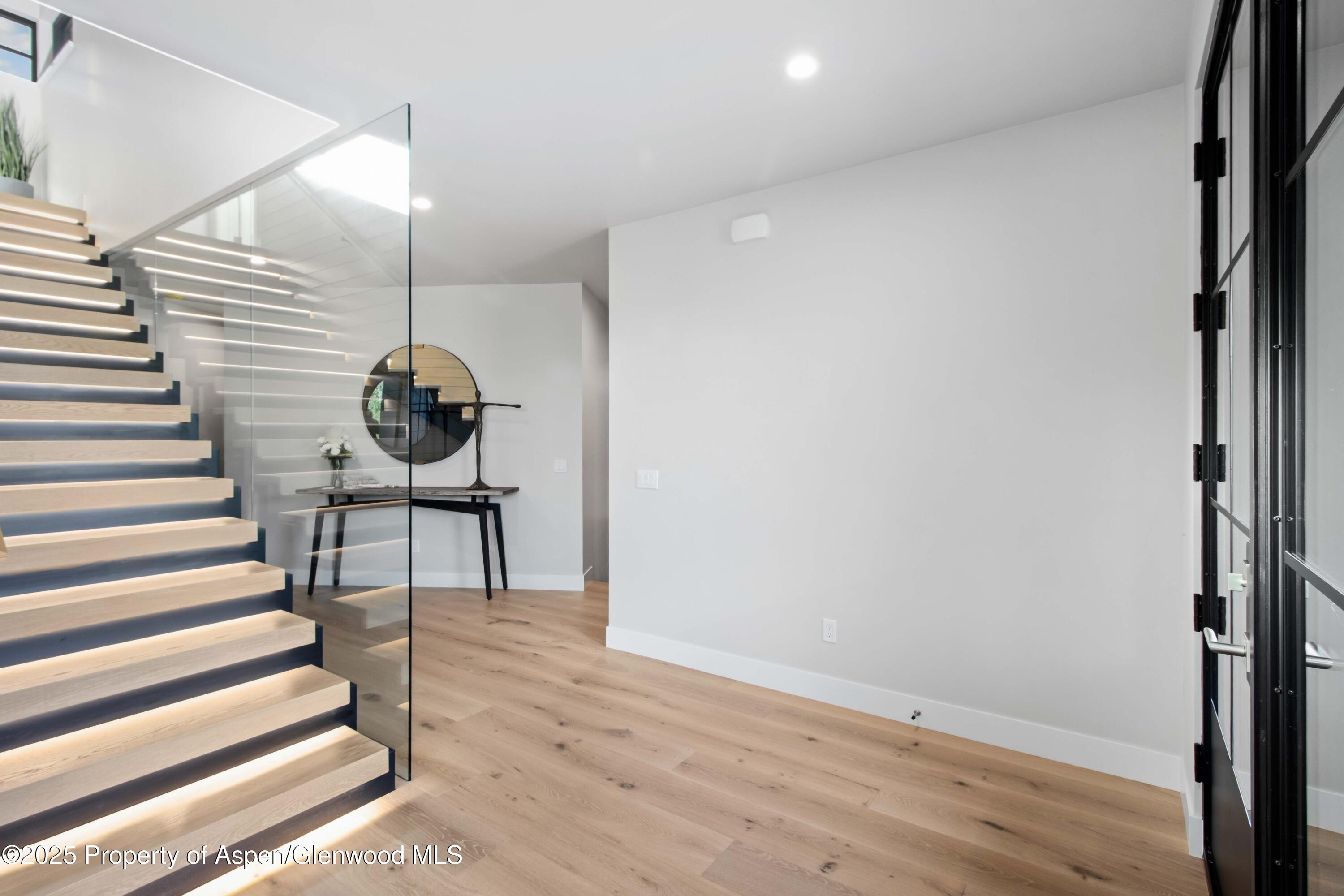 719 Perry Ridge Carbondale, CO 81623 - Photo 62 of 68 a view of entryway and hall with wooden floor