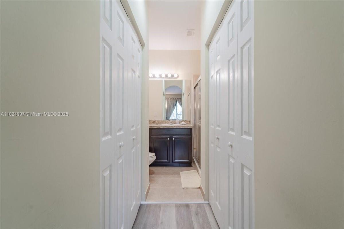 370 Lake Monterey Circle Boynton Beach, FL 33426 - Photo 16 of 17 a bathroom with a sink and a mirror