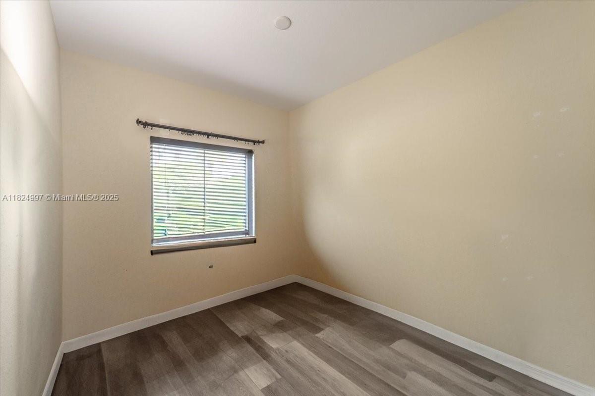 370 Lake Monterey Circle Boynton Beach, FL 33426 - Photo 3 of 17 an empty room with a window