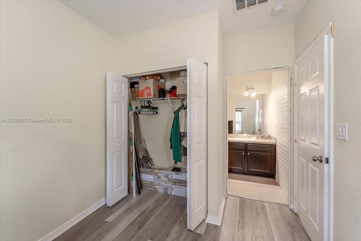 370 Lake Monterey Circle Boynton Beach, FL 33426 - Photo 4 of 17 a view of a bathroom from a hallway