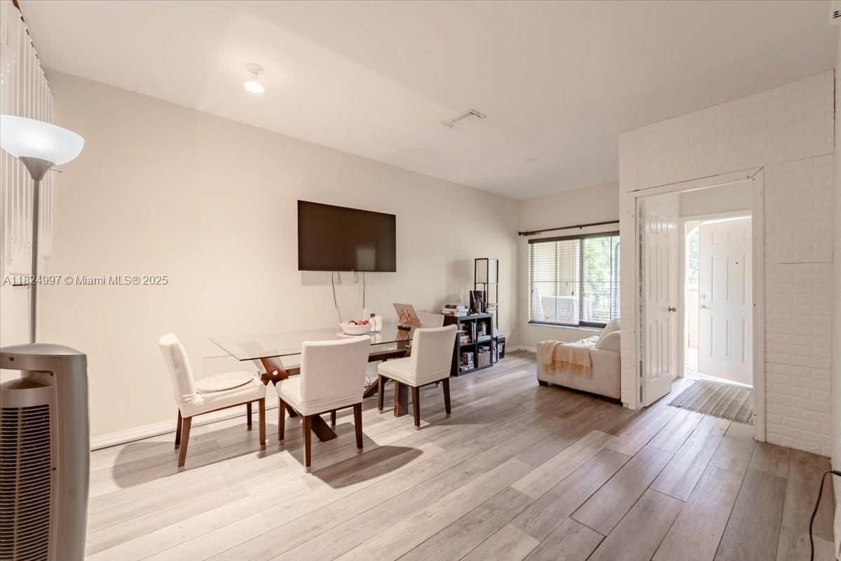 370 Lake Monterey Circle Boynton Beach, FL 33426 - Photo 7 of 17 a living room with furniture and a flat screen tv