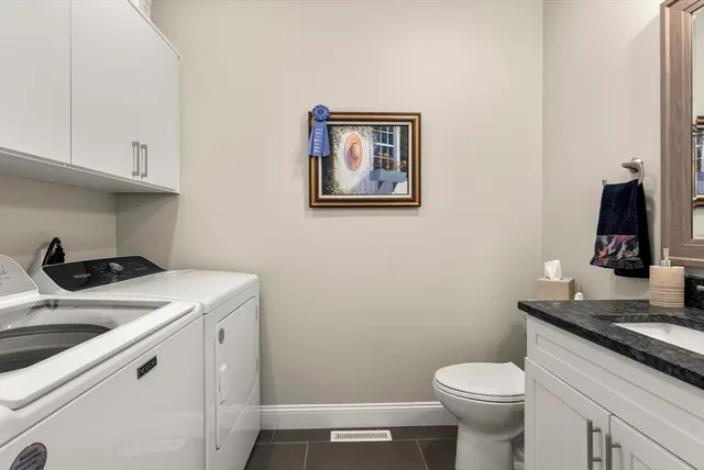 a view of a house with backyard and porch