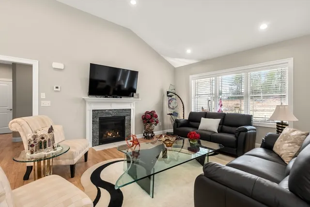 a kitchen with white cabinets stainless steel appliances a sink and a stove