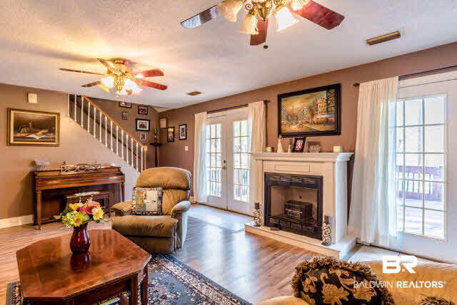 7412 Lott Road Wilmer, AL 36587 - Photo 4 of 25 Family Room. Double doors lead to outside deck.