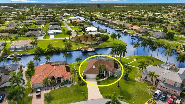 an aerial view of residential houses with outdoor space and swimming pool