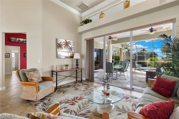a kitchen with stainless steel appliances kitchen island granite countertop a stove and white cabinets