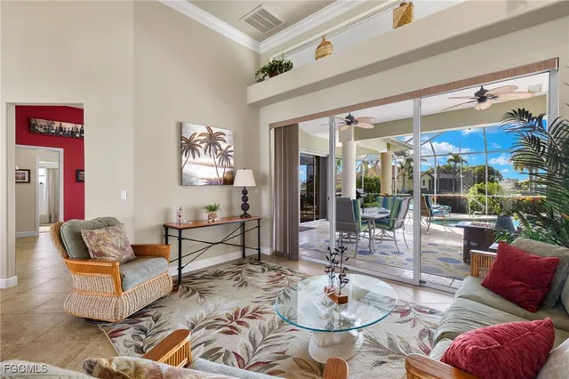 a kitchen with stainless steel appliances kitchen island granite countertop a stove and white cabinets