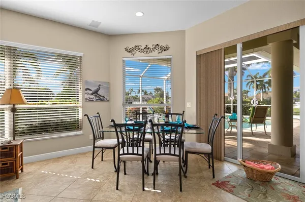 a view of a dining room with furniture and window
