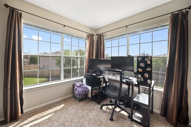 a workspace with furniture and a window