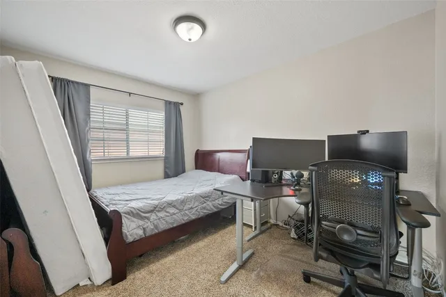 a bedroom with a bed and furniture