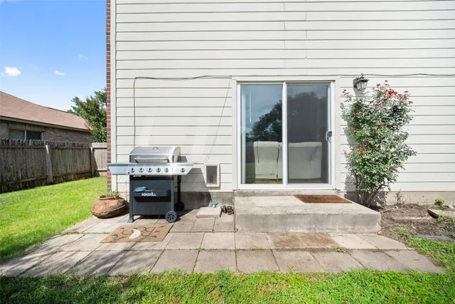 a backyard of a house with yard and outdoor seating