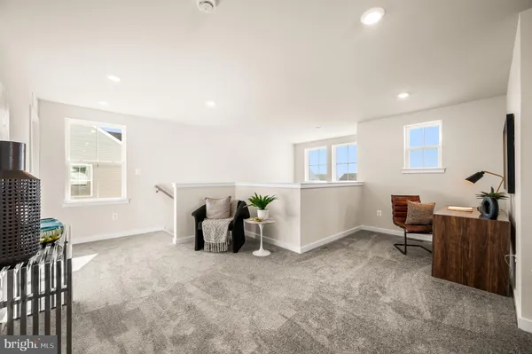 a view of a livingroom with furniture and windows