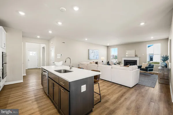 a open kitchen with sink stove top oven and refrigerator