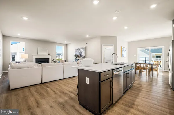 a kitchen with a stove and white cabinets
