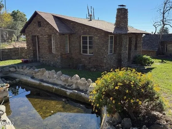 a view of a swimming pool with outdoor seating