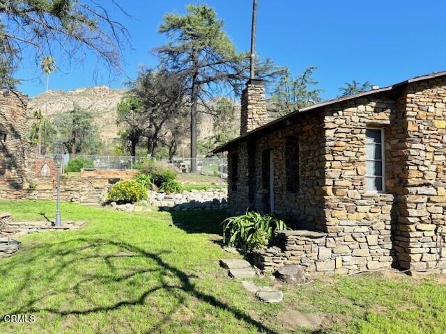 294 Wapello Street Altadena, CA 91001 - Photo 39 of 48 a view of backyard with potted plants and a bench