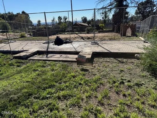 a view of a backyard of the house