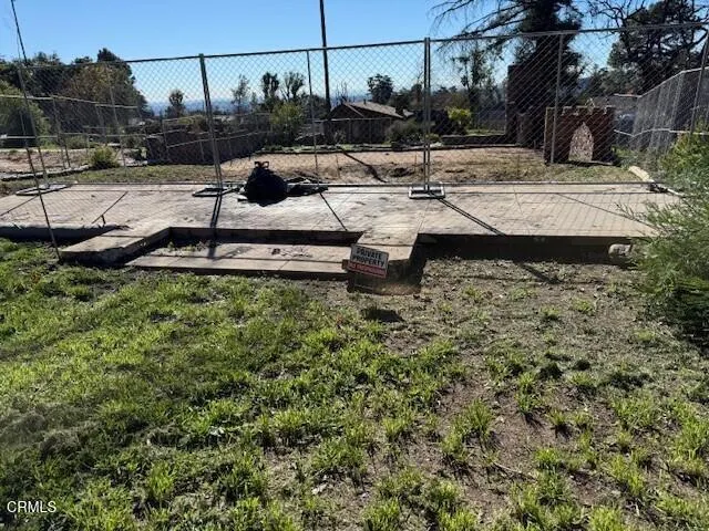 a view of a backyard of the house