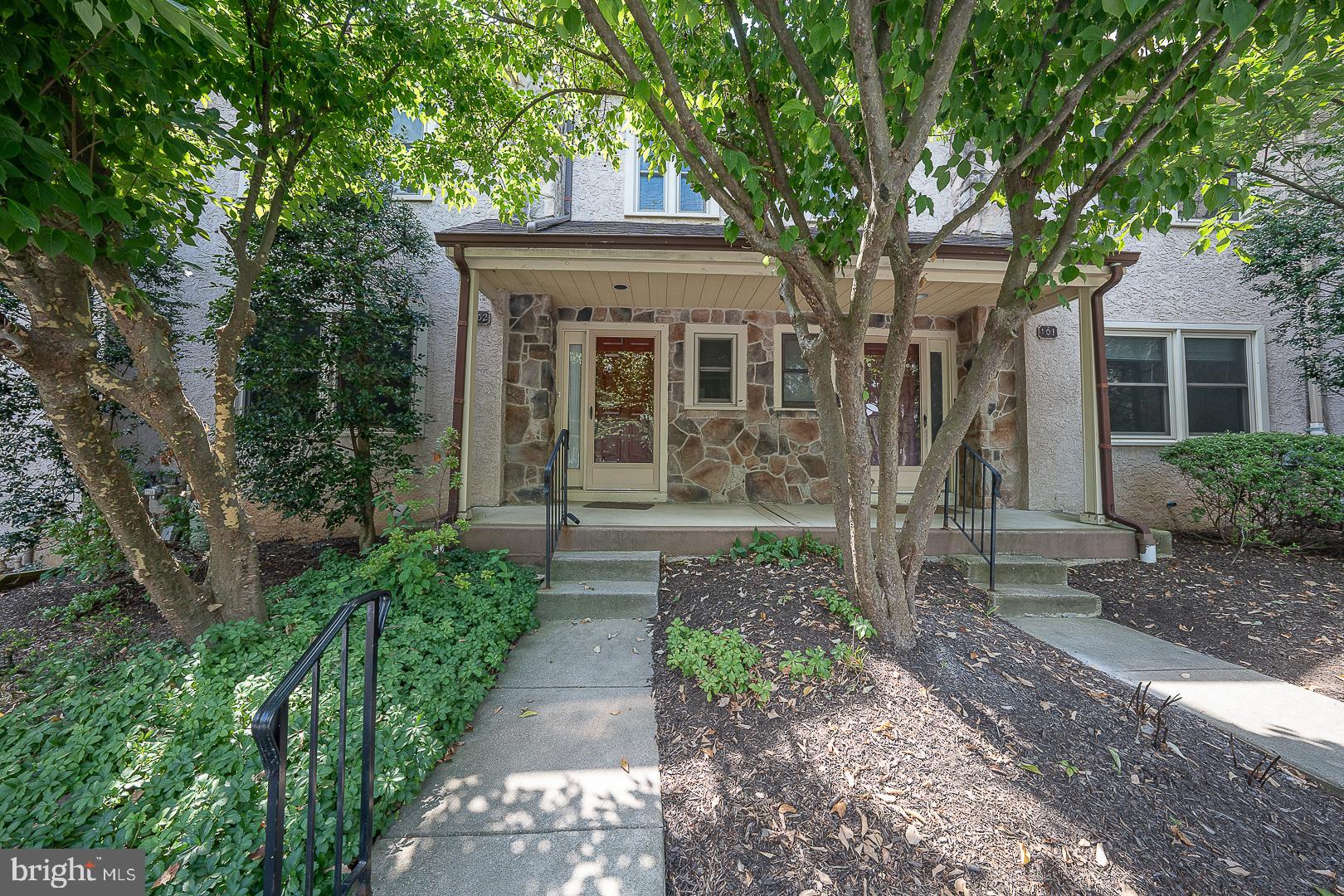 102 Beacon Square Wayne, PA 19087 - Photo 1 of 48 Charming entrance framed by lush greenery.