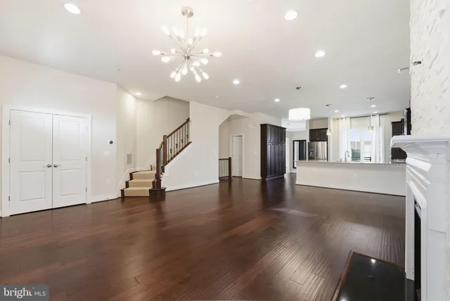 a view of a kitchen with a sink and a floor to ceiling window