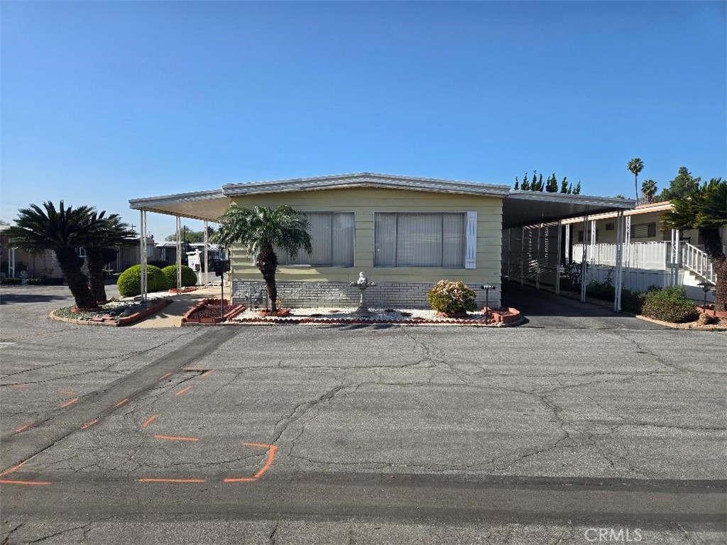 840 East Foothill Boulevard Azusa, CA 91702 - Photo 4 of 5 a front view of a house with cars parked
