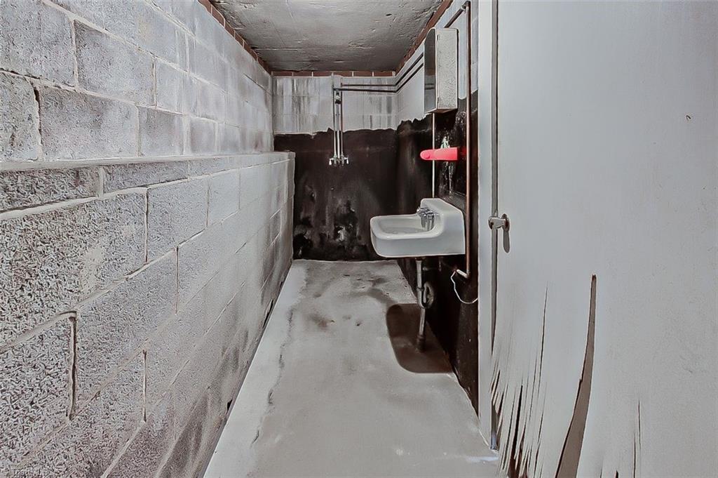 1597 Wicker Lovell Road Randleman, NC 27317 - Photo 26 of 48 basement "bunker" with sink & shower
