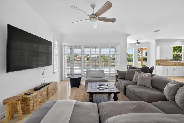 a dining room with furniture window and wooden floor
