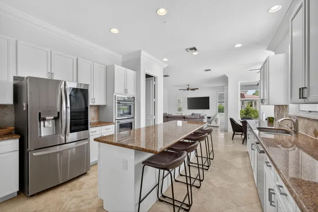 a bedroom with two beds and a chandelier