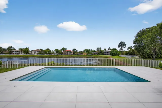 a bedroom with a bed and a ceiling fan