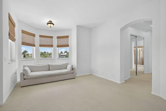 an aerial view of a house with outdoor space and lake view